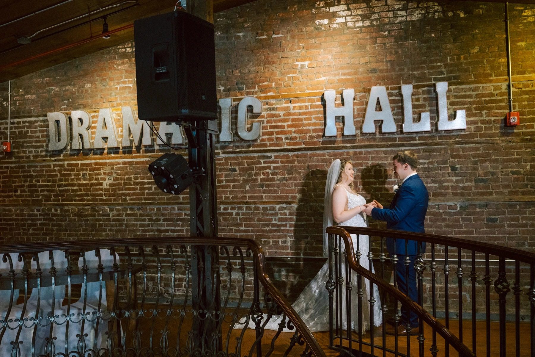 Bride and groom exchanging vows or sharing a moment on an interior staircase — Wedding at Dramatic Hall, peekskil, ny