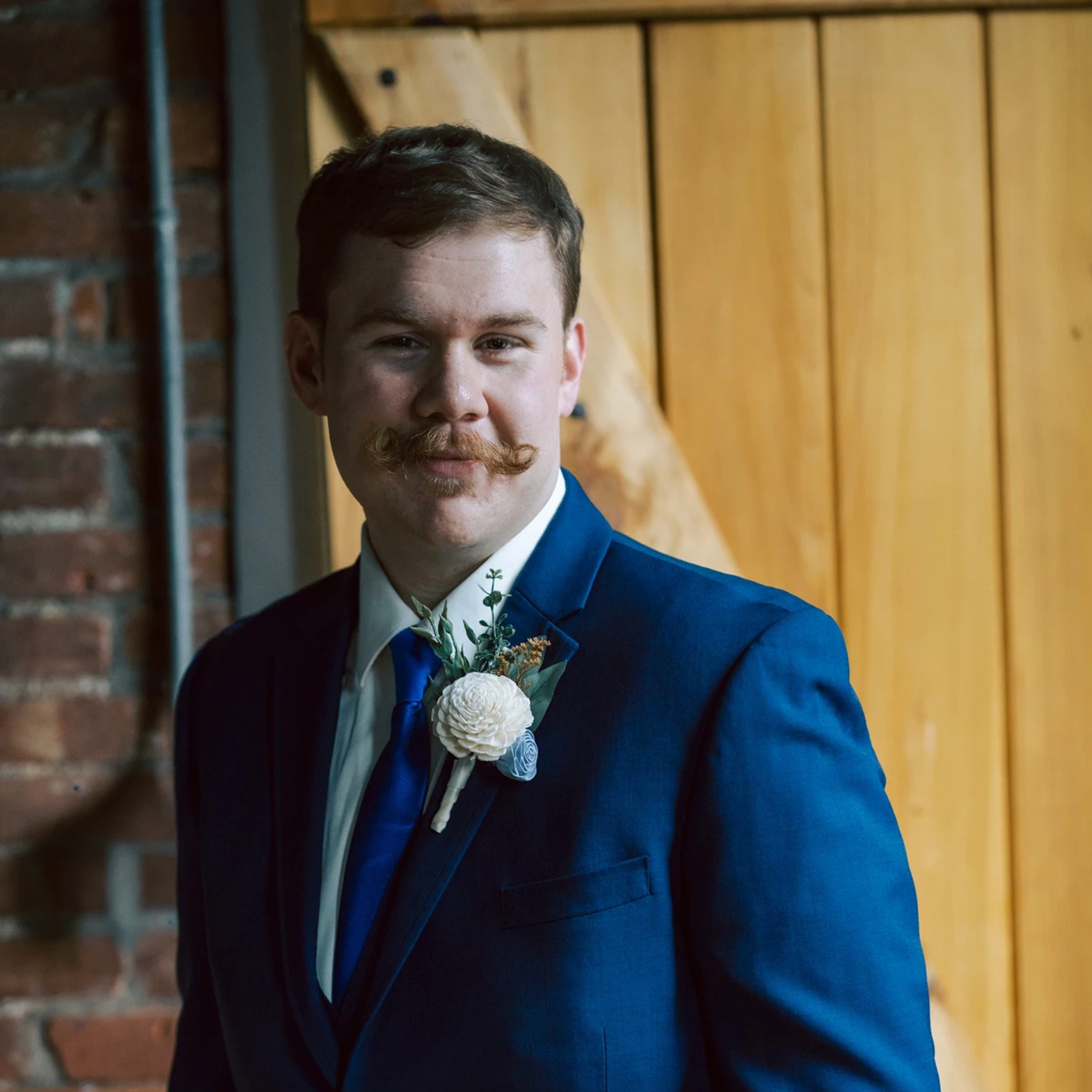 Groom standing for a formal portrait in an industrial venue. — Wedding at Dramatic Hall, peekskil, ny